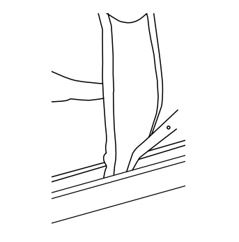 Hand separating trim piece from the end of the retention frame