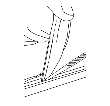 Hand pulling trim strip away from retention frame corner during removal step