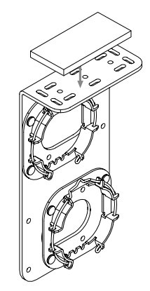 Leveling shim being attached to a dual shade mounting bracket, exploded view