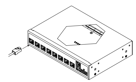 Isometric diagram of Janus controller showing front ports and hexagonal top panel with power connector attached