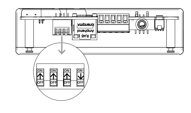 Close-up of four DIP switches on KAOS control board, three set to ON and one set to OFF