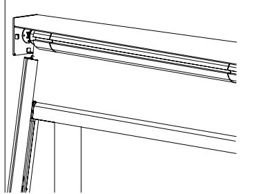 KAOS V1 housing mounted to wall with roller tube and end cap installed at corner position