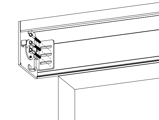 KAOS housing end cap mounted to ceiling bracket with self-tapping screws at wall junction