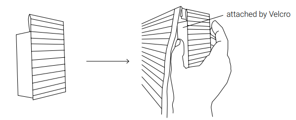 Hand peeling Velcro-attached bracket away from shade headrail during installation
