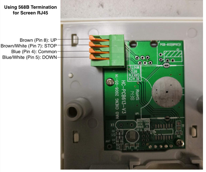 568B RJ45 wiring diagram showing four labeled terminal pins on green PCB: UP, STOP, Common, and DOWN