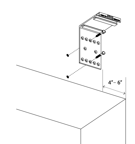 Wall mount bracket secured at ceiling corner, positioned 4-6 inches from wall end