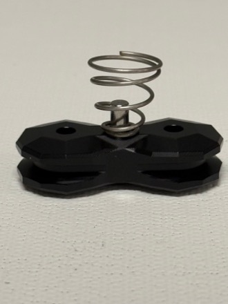 Black double-wheel Onyx guide assembly with coiled metal spring on top
