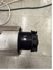 Black motor head end of KAOS tube with C-clamp secured motor plate visible