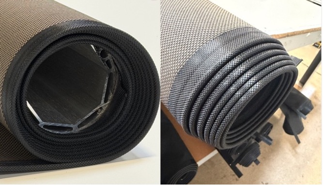 Rolled KAOS fabric showing hollow tube core exposed on left and coiled guide rope along fabric edge on right